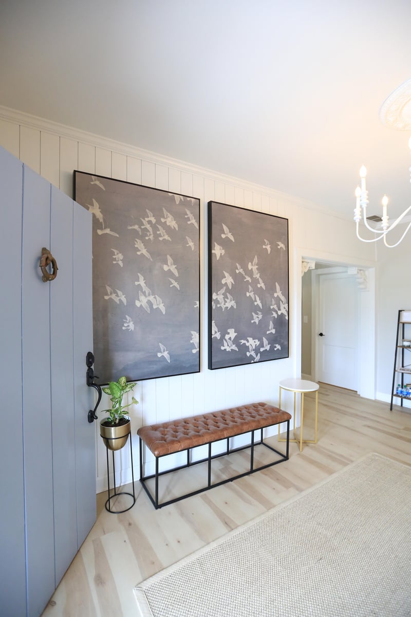 TN Mental Wellness inside office view showing two large paintings of white birds flying on the wall and bench underneath in big spacious room